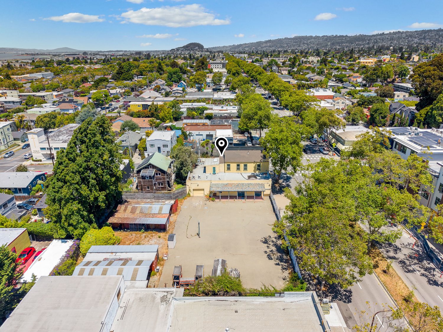 Aerial view of the site with the Berkeley hills in the background.